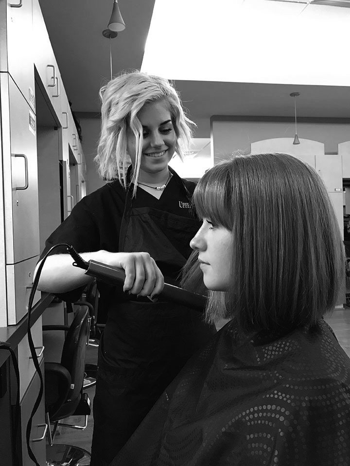 Students at UVCC Practice Styling Hair